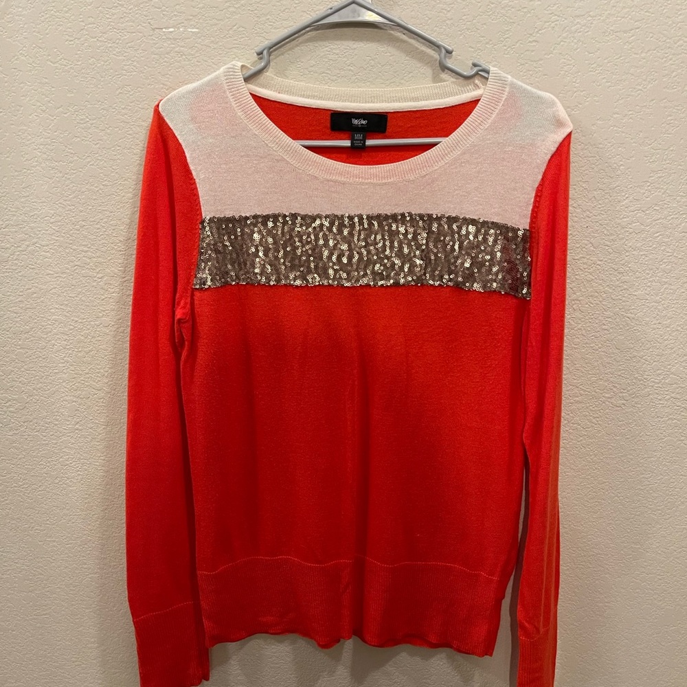 Woman’s size medium knit sweater.
